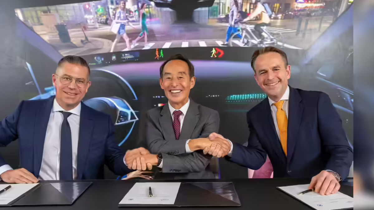 Harman and ZF executives marking a driver-assistance software acquisition