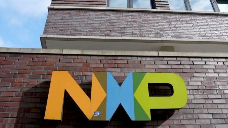 NXP corporate logo mounted on brick building exterior
