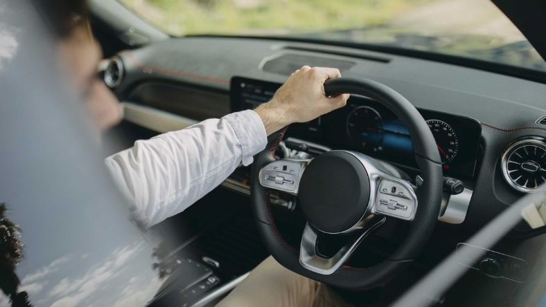 Driver using digital dashboard in modern connected car